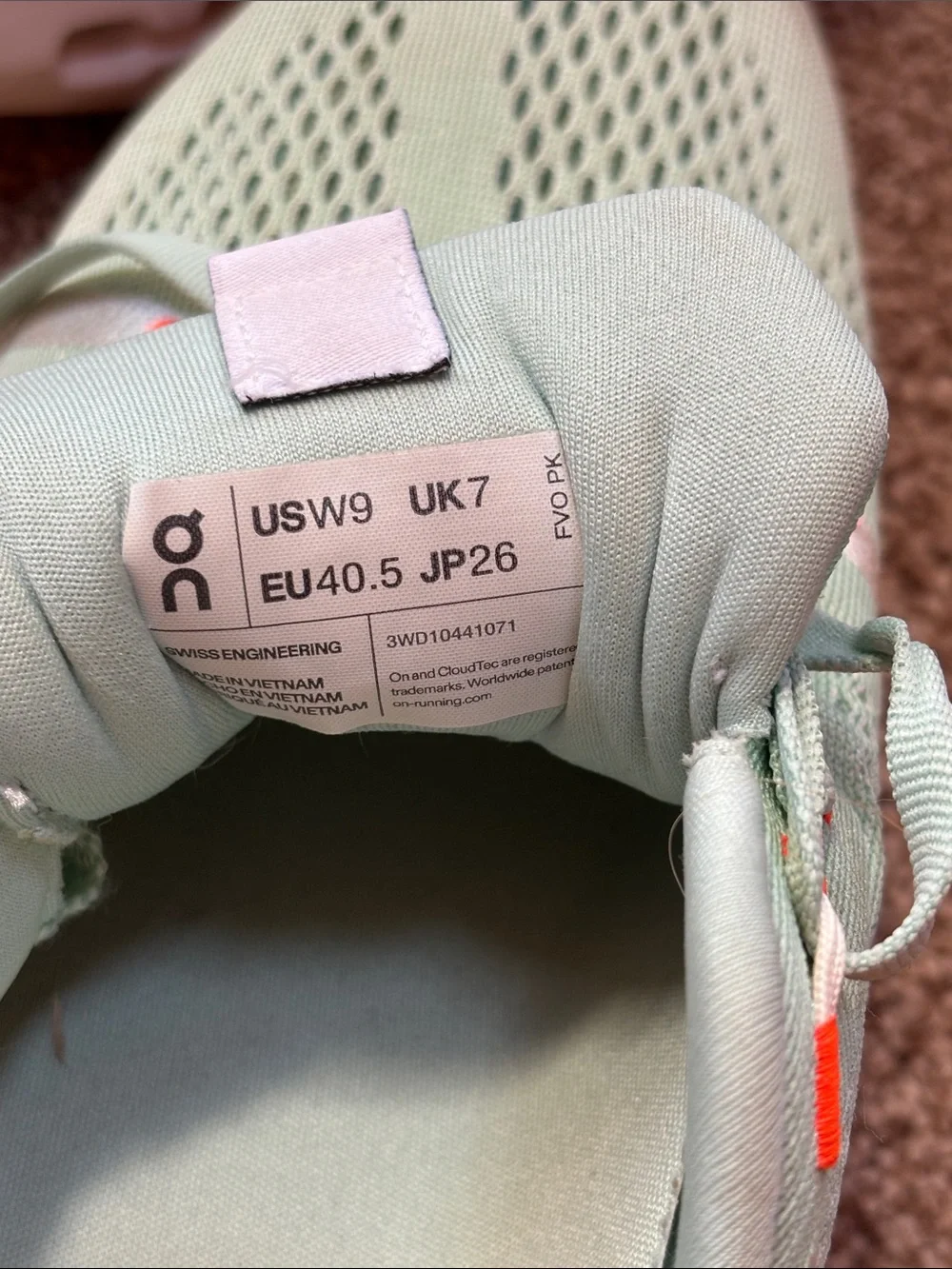 On Running Sneakers in Mint Green with Orange Accents